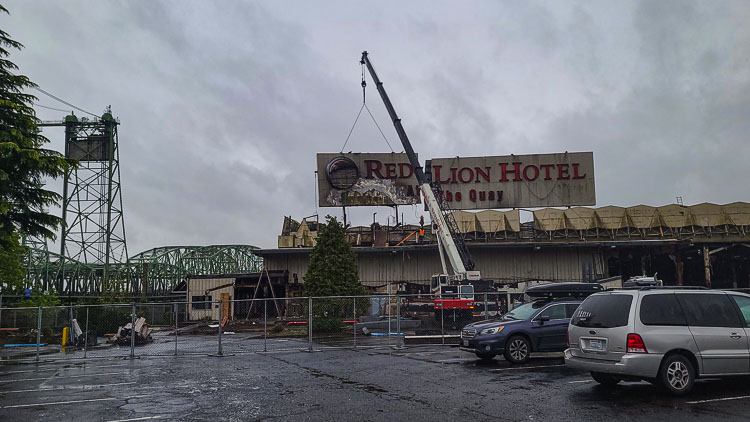 The contractors planned to take down the sign in three sections. Photo by Paul Valencia
