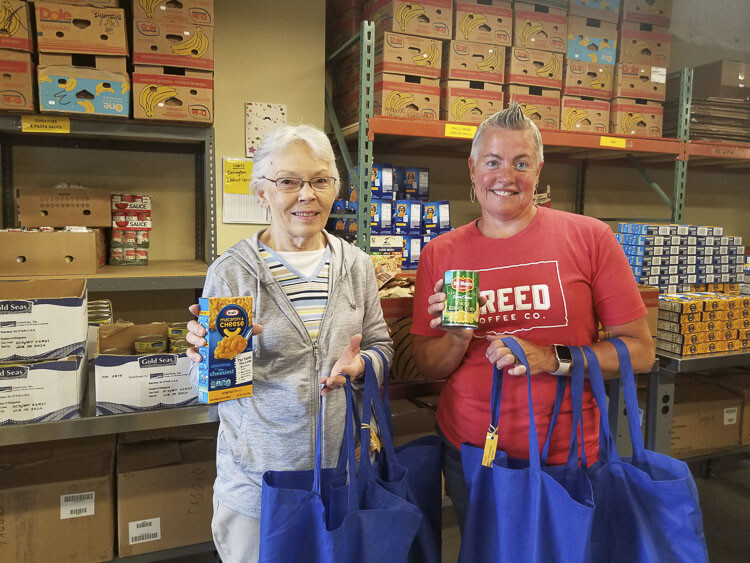 Each week during the school year, dozens of volunteers fill 850-plus bags with non-perishable food which are delivered to schools on Thursdays to provide families with the staples needed for two meals during the weekend. Photo courtesy Share