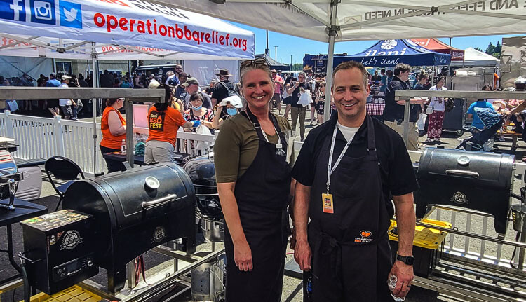 Kateri and Fred Harrison of Clark County Sheriff’s Office loved their experience Sunday, learning new tricks for the grill and competing with other first responders in a cooking competition. Photo by Paul Valencia