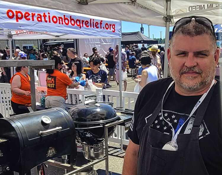 Steve Harris of Cowlitz Tribe Public Safety said he was a winner Sunday for just being part of the Operation BBQ Relief competition. First responders were given cooking classes from experts, then tried their skills. Photo by Paul Valencia