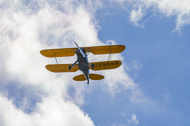 A biplane flew over Heroes Night in 2019, and more biplanes are expected to fly Saturday at Heroes Night. Photo by Mike Schultz
