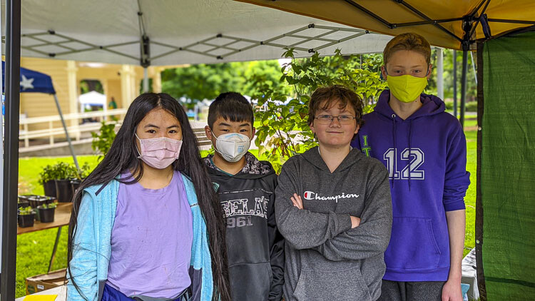 Acacia Hwang (16), Micah Hwang (13), Jacob Quellette (14), and Wyatt Howard (13) allowed their hobby to inform their business. I.F. Robotics, a new high school community robotics team based out of Vancouver, incorporated robotics into their business plan, selling entertainment alongside plants in 3D-printed pots. Photo courtesy Jessica Hofer Wilkinson