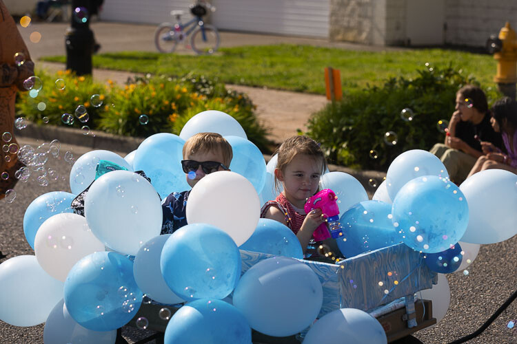 Reed Musgrove (left) and Charlotte Vogel are all about the bubbles during the Children’s Parade on the first day of Planters Days in Woodland. Photo by Mike Schultz