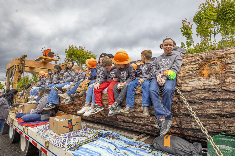 These children had a nice log bench to ride through the parade, courtesy of Chilton Logging. Photo courtesy Mike Schultz