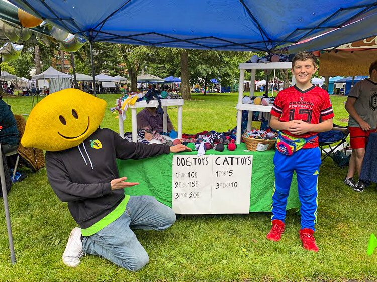 T-Ray Brazier, 12, used a recent family move to recycle unwanted T-shirts into toys for cats and dogs. He was inspired by his Goldendoodle named Ginger, who helped test his product creation. Brazier braided T-shirt material around tennis balls to create a durable and much-loved toy for dogs. Photo courtesy Jessica Hofer Wilkinson