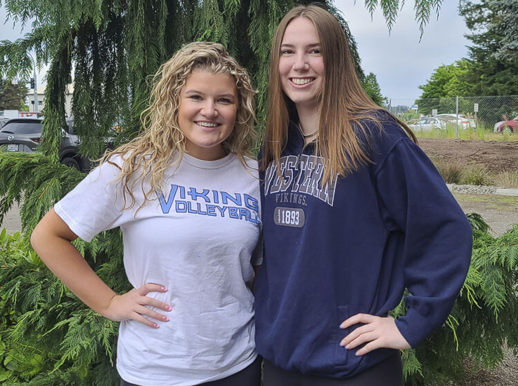 Caroline Hansen, left, and Emily Vossenkuhl were fierce rivals in high school while friends off the volleyball court. Hansen, a graduate from Columbia River, and Vossenkuhl, a graduate from Ridgefield, both won state championships in their high school days. Now they are teaming up and will be roommates at Western Washington University. Photo by Paul Valencia