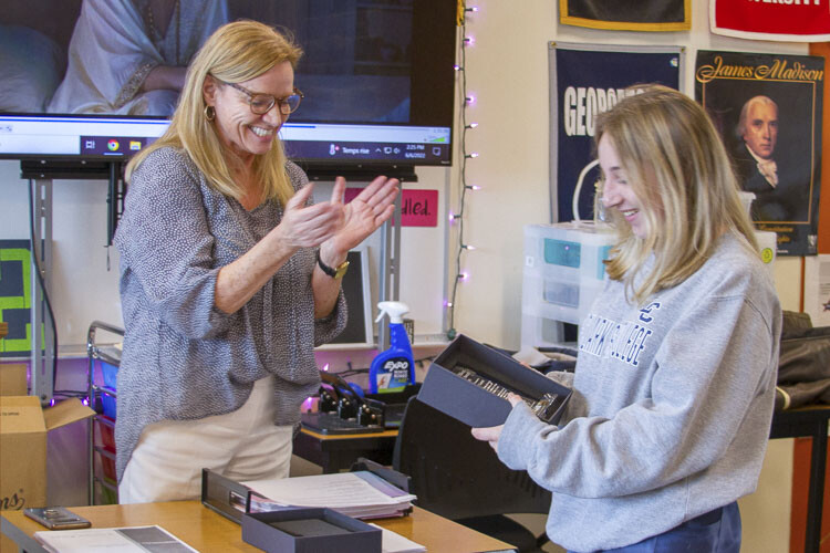 Mary Ann Sturdivan, WHS Career Specialist, presents Taylor Curnutt (Class of 2022) with the Silent Service Award. Photo courtesy Woodland School District