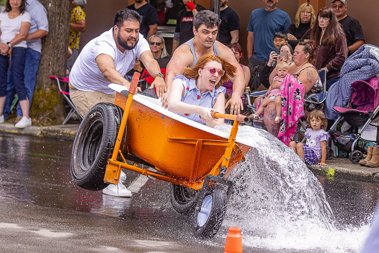 Alex Monzo, Ian Sloan and Sydney Randolph pushed it to the limit in the Bathtub Races. Photo by Mike Schultz