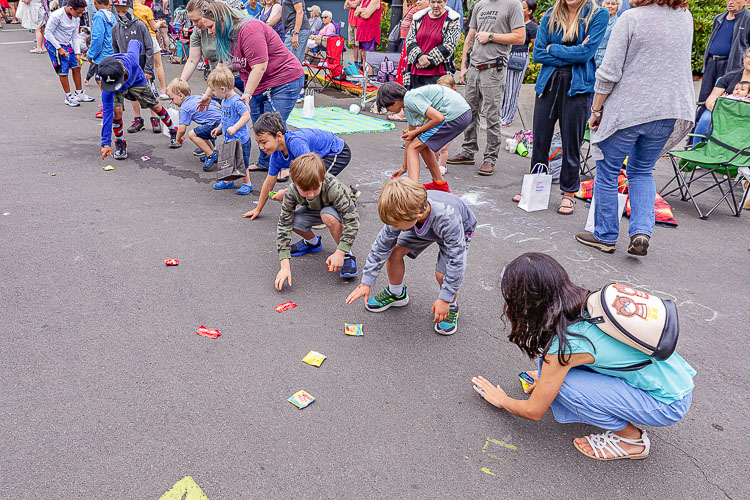 Children love candy so children love parades. Photo by Mike Schultz