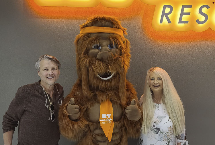 Mike and Denise Werner hang out with Squatchy the Sasquatch, the mascot of RV Inn Style Resorts. The Werners have been building businesses for close to 40 years. They own RV Inn Style Resorts, and the brand is growing throughout the Northwest. Photo by Paul Valencia