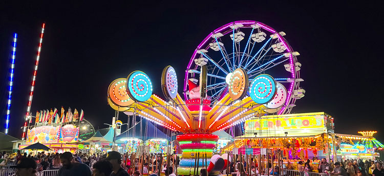 The Clark County Fair’s carnival stayed open for more than an hour after closing time, trying to accommodate all the people who were still hoping to enjoy one final thrill ride. Photo by Paul Valencia