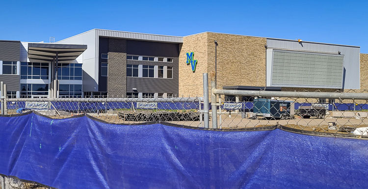 A fence is up around the border of the active construction zone, but the new Mountain View High School is set to open for students on Tuesday. The old high school was demolished over the summer. That space will be used for more athletic fields and a parking lot. Photo by Paul Valencia