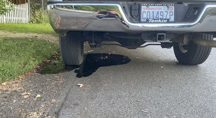 Upon investigation, legislative candidate Jeremy Baker discovered that some time in the night, thieves had drilled into his gas tank and drained most of the fuel, leaving the rest to pour dangerously onto the ground. Photo courtesy Jeremy Baker campaign
