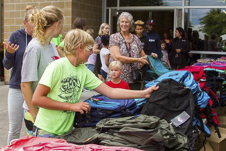 Woodland Public Schools provided hundreds of free backpacks filled with school supplies to students in need at this year’s sixth annual Back-to-School Bash