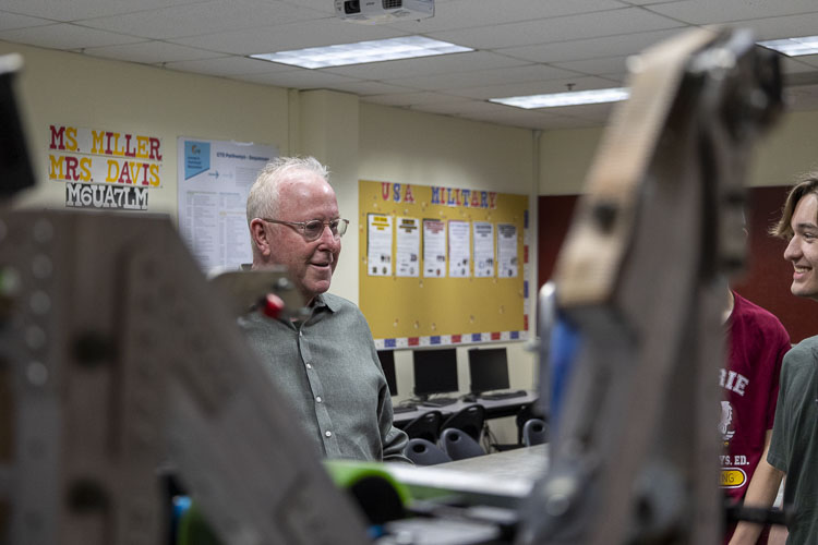 SBI CEO Raymond Near talks with students at Prairie High School after awarding their CloverBots program with a $10,000 grant. Photo courtesy Battle Ground School District