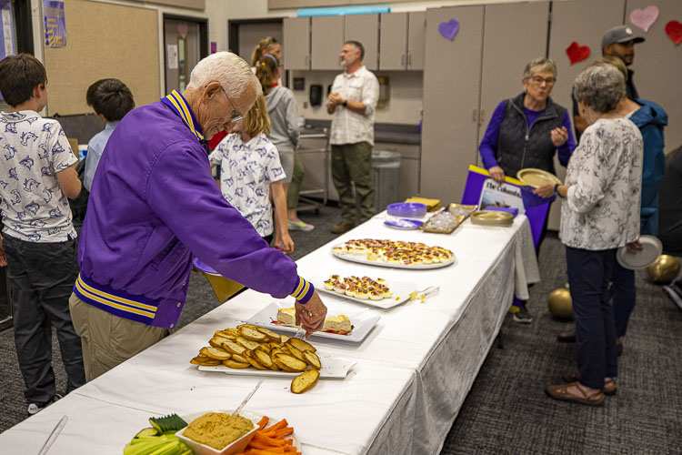 Family, friends, former players, and Columbia River community members gathered to share stories of former coach John O’Rourke, who died last year. O’Rourke taught and coached at River for decades. Photo by Mike Schultz