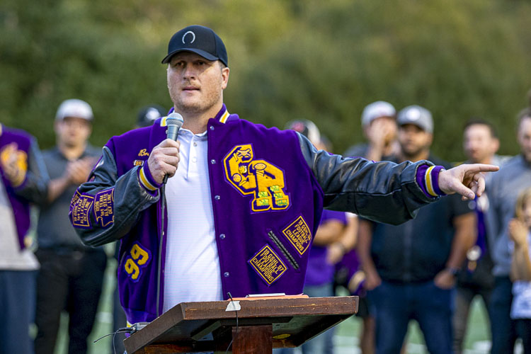 Brett Pierce can still fit into his letterman’s jacket from the Class of 1999 at Columbia River. Pierce flew in from Texas to pay tribute to his former coach. The new athletic field at Columbia River High School is now called John O’Rourke Field. Photo by Mike Schultz