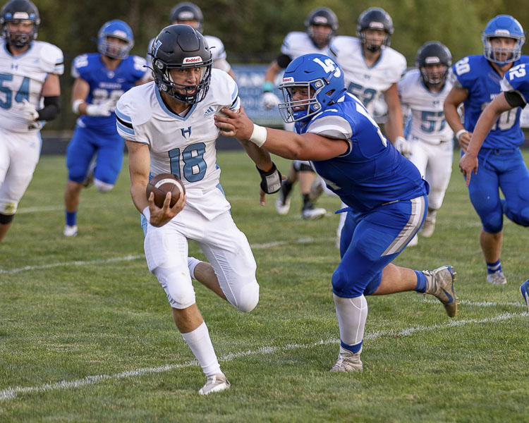 Hockinson quarterback Jarod Oldham threw for 137 yards and a score and rushed for 86 yards and a score as the Hawks rallied to beat La Center 19-14 on Friday. Photo by Mike Schultz
