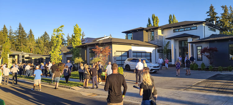 Folks mingle at Zephyr Point in Ridgefield where the 2022 GRO Parade of Homes is located this year. The Parade opened last week and resumes Wednesday. The Parade of Homes will run through Sept. 25 but is closed on Mondays and Tuesdays. Photo by Paul Valencia