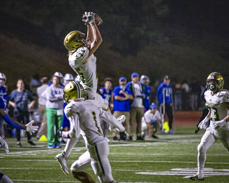 Cole Cuypers went up and got this interception for the Evergreen defense. Evergreen forced three Mountain View turnovers. Photo by Mike Schultz