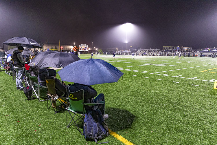 King’s Way Christian fans knew to bring their own chairs and umbrellas to this Week 9 rivalry game at Seton Catholic. Photo by Mike Schultz