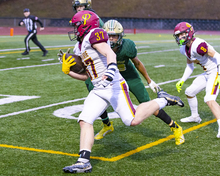 Pierson Lameh was all over the field for the Prairie Falcons on Friday, helping out on offense with his strong running and blocking skills and dominating as a linebacker on defense. Photo by Mike Schultz