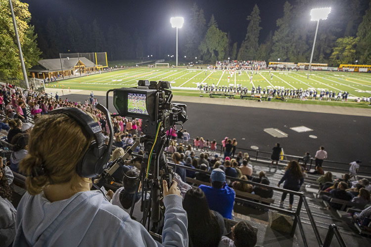 Maeli McLain, a sophomore at Skyview, operates one of the cameras at Kiggins Bowl for the Skyview-Camas football game last week. Students from Vancouver Public Schools do most of the work for VPS Game Time broadcasts. Photo by Mike Schultz