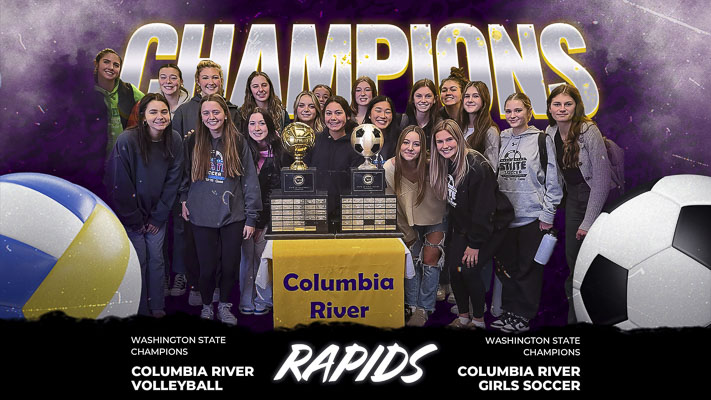 Some members of the Columbia River volleyball and girls soccer teams showcase their trophies. Both teams won state championships Saturday night. Photo by Paul Valencia