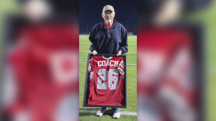Dan Wood was honored with a David Douglas High School jersey for his 26 years as head coach of the Portland school. Clark County Today reporter Paul Valencia was coached by Wood back in the 1980s. Valencia writes that coaches such as Wood make high school athletics so important. Photo by Paul Valencia