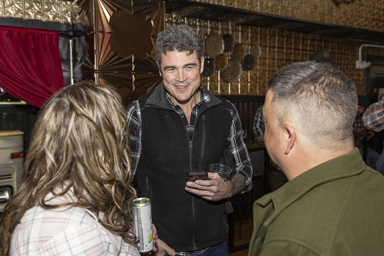 Joe Kent interacts with some of his supporters Tuesday night in Brush Prairie. Photo by Mike Schultz