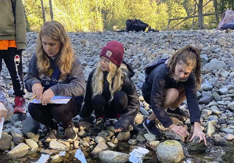 (left to right) Ruby Stenbak, Jane Murri, Sophie Lanham collect water samples as part of a science lesson. Photo courtesy Ridgefield School District