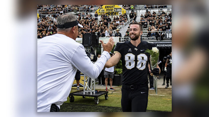 A 25-year-old former college football player died after suffering a heart attack while jogging.