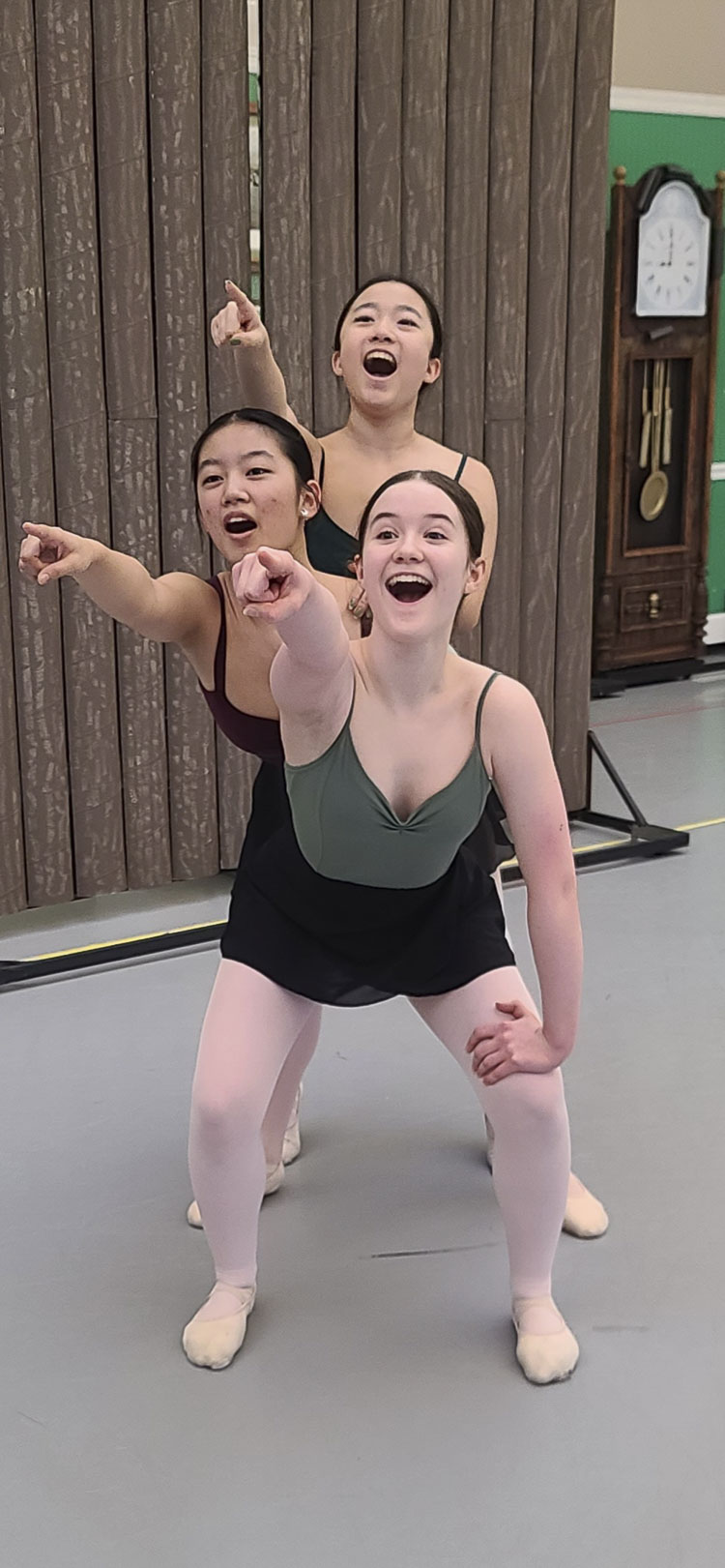 From top to bottom, Sophia Yan, Jenny Wang, and Serena Malcolm are excited to see land. They are portraying castaways that survived 14 months at sea before arriving at what is now Washington. Yan, Wang, and Malcolm are members of Columbia Dance. Photo by Paul Valencia