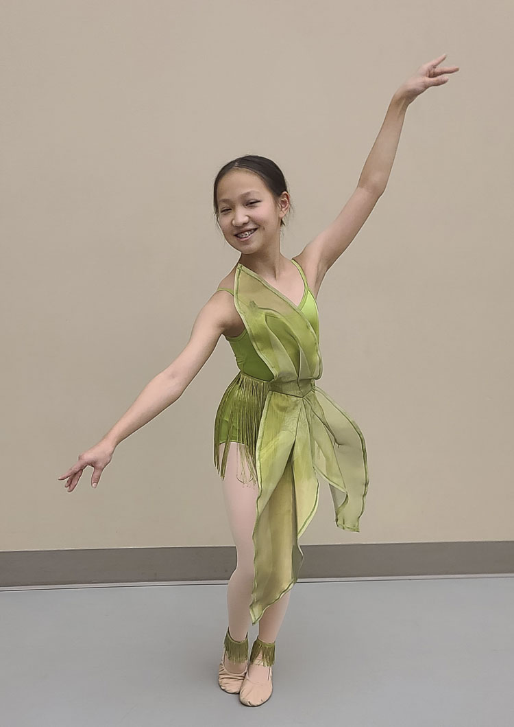 Liya Zhao shows off her wapato plant costume for Columbia Dance’s adaptation of the Nutcracker, which will feature Northwest history. Photo by Paul Valencia