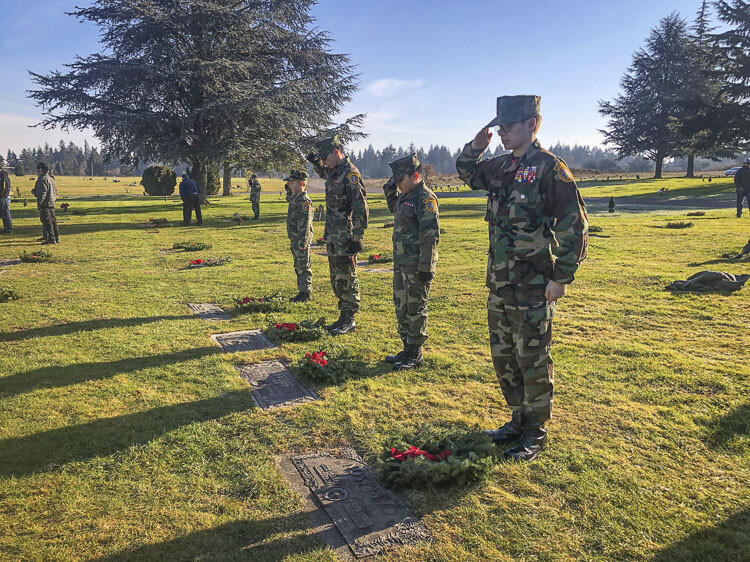 The Lewis and Clark Young Marines were asked to say the veteran’s name while placing the wreath, followed by a slow salute. Photo by Andi Schwartz