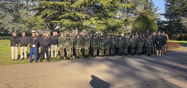 The Lewis and Clark Young Marines placed wreaths on more than 800 veterans who are buried at Evergreen. Each year, donated wreaths are delivered all across the country for this December event. Photo by Andi Schwartz
