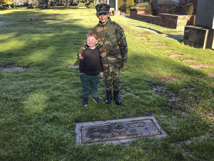 Kainan Schwartz (right) of the Lewis and Clark Young Marines and brother Randy are shown here Saturday at the annual Wreaths Across America event at Evergreen Memorial Gardens. Photo by Andi Schwartz