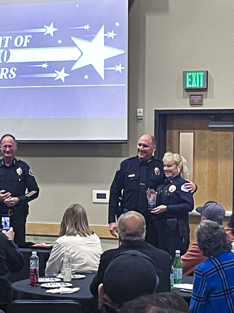 Battle Ground Police Chief Mike Fort and VPD Chief Jeff Mori present Lt. Kathy McNicholas with the Lifetime Achievement Award. Photo courtesy Leah Anaya