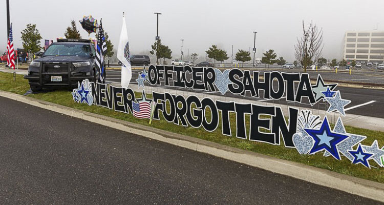 A tribute to Vancouver Police Officer Donald Sahota was displayed outside his Memorial Service on Feb. 8, 2022 at the ilani Resort Casino. Photo by Mike Schultz