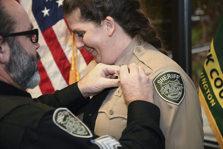 The pinning of the badge. Photo courtesy Clark County Sheriff’s Office