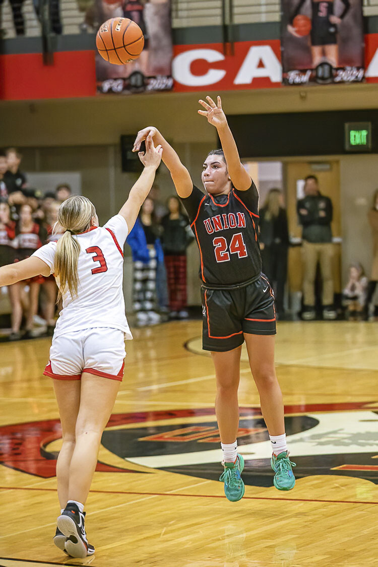 Ava Smith of Union helped the Titans get back in the game in the second half Tuesday. Smith used to play for Camas. Now, she is on the other side of the rivalry, playing for the Titans. Photo by Mike Schultz