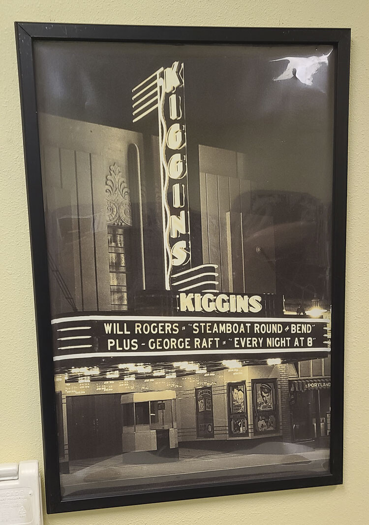 A picture of Kiggins Theater hangs on the wall of an office at the Vancouver Sign Company. Vancouver Sign Company built the original Kiggins Theater sign. Photo by Paul Valencia