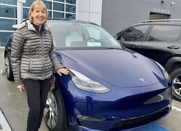 Clark County resident Donna Madore is shown here with her new Tesla Model Y Long Range vehicle. Photo courtesy David Madore