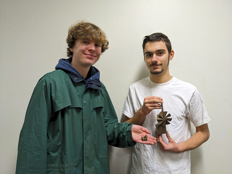 Joseph Williamson, Oliver Ferguson, Gold, Additive Manufacturing) Joseph Williamson (left) and Oliver Ferguson programmed a 3-D printer to create a device that used a vacuum cleaner as a wind source to lift a marble payload. Their design was judged the lightest weight, which earned them the gold medal in the Additive Manufacturing category. Joseph, a second-year student from River Homelink in the Battle Ground School District, plans to attend WSU/Vancouver and major in mechanical engineering. Oliver is a first-year student from Firm Foundation Christian School who plans to attend Embry-Riddle University to major in Aeronautical Engineering. Photo courtesy Evergreen School District