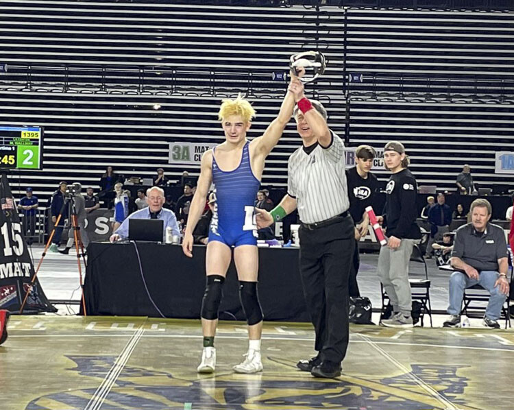 Malachi Wallway won his state title for La Center with a pin in overtime Saturday night at Mat Classic. A senior, he said he hopes his achievement is an inspiration to younger La Center wrestlers. Photo courtesy WIAA