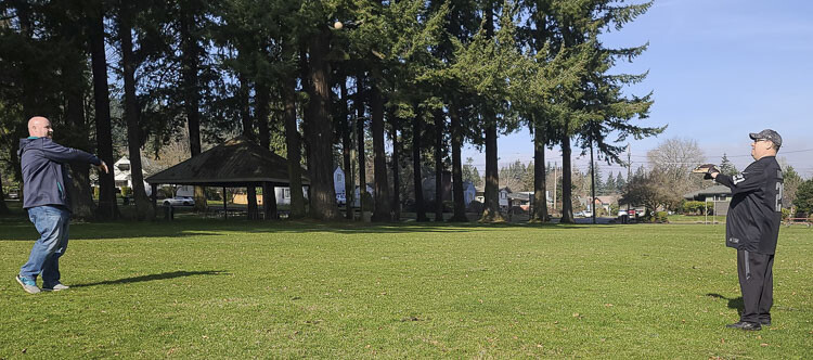 John Scukanec of Washougal plays catch with Clark County Today reporter Paul Valencia in Camas on Sunday. That was Day 348 of Scukanec’s mission to play catch every day for a year. Photo courtesy Jenny Valencia