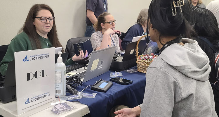 The Washington State Department of Licensing was on hand Saturday at the Thrive 2 Survive event, a health and wellness outreach clinic for the homeless. There was a big demand for those getting renewed licenses or their first ID cards. Photo by Paul Valencia