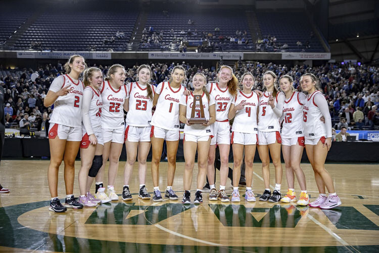 One of the toughest things to do in high school sports is pose for a picture with the second-place trophy, just seconds after defeat. The Camas Papermakers displayed class, doing their best in a difficult situation. Photo courtesy Heather Tianen