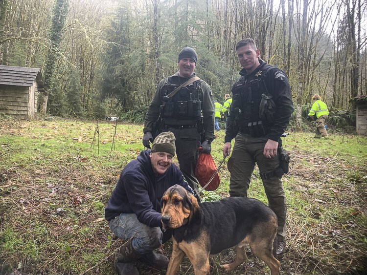 Cowlitz County Sheriff’s Deputies James Doyle and Landen Jones are shown here with Vancouver resident Nathan J. Mueller and his dog. Photo courtesy Cowlitz County Sheriff’s Office