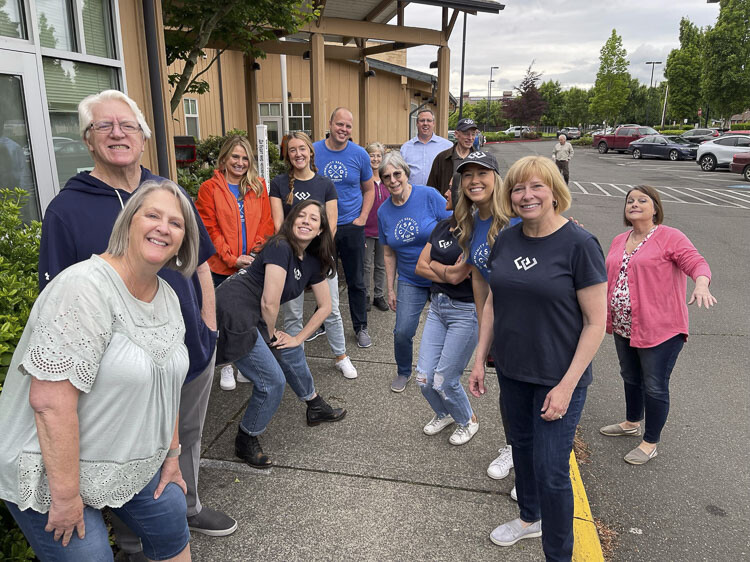 Volunteers are shown here at Windermere's annual community service day, where the local brokers collected food for the Fruit Valley Elementary School. Photo courtesy Windermere Real Estate